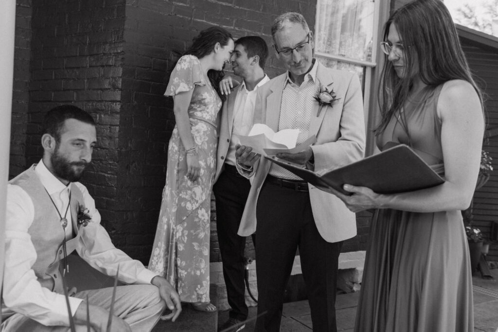A candid black and white wedding photo taken by a documentary style wedding photographer