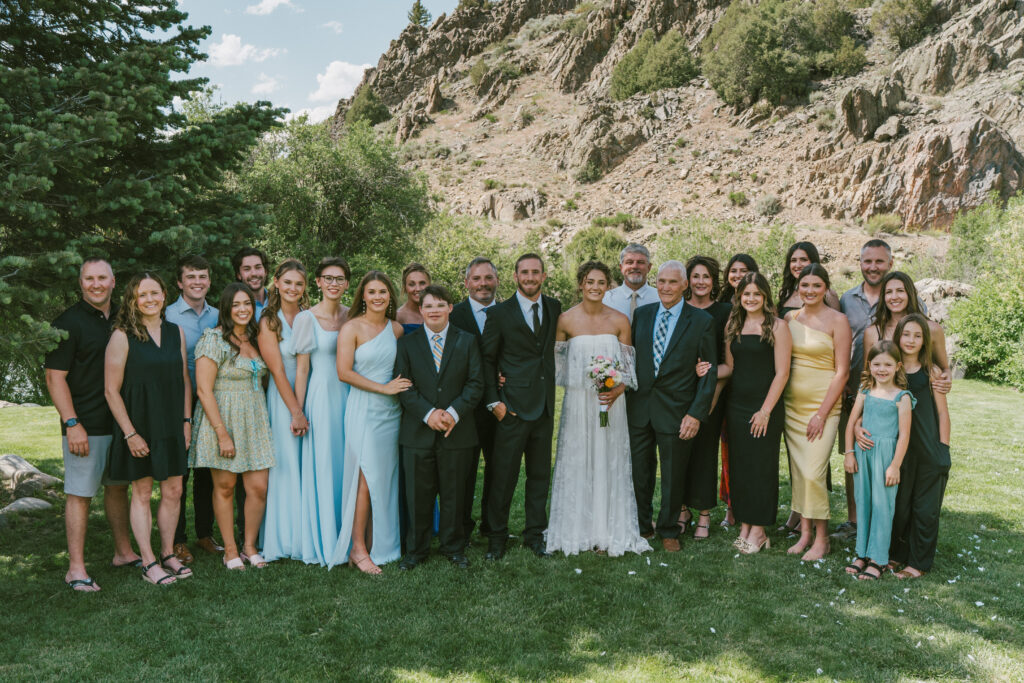 A large family wedding portrait taken by a documentary style wedding photographer
