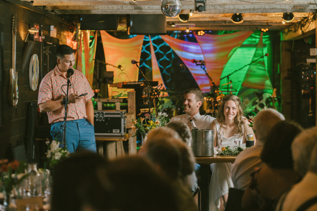 Couple laughing during speeches at Colorado wedding venue
