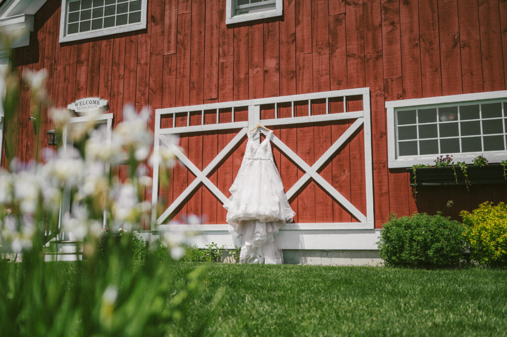 Wedding dress hanging in front of a Colorado wedding venue