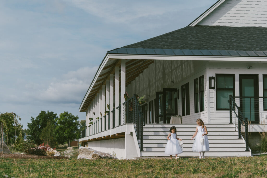 Flower girls walking to ceremony at Colorado wedding venue