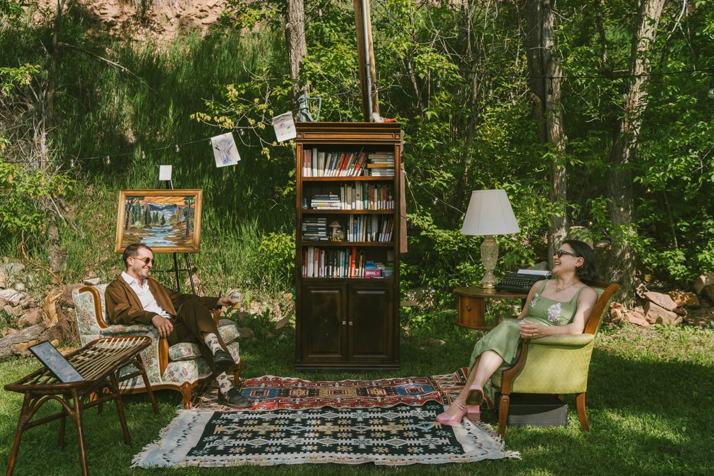 Guests mingle during reception at wedding at Stone Mountain Lodge in Lyons Colorado